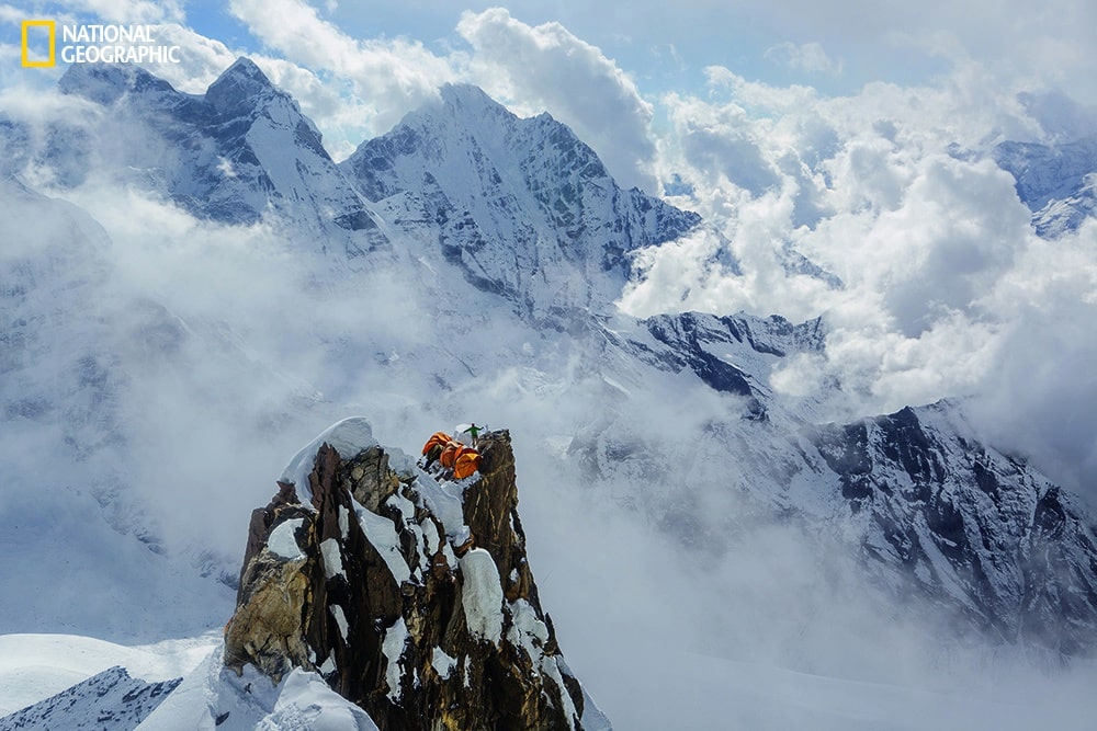 Photo by Aaron Huey/National Geographic Da Nuru Sherpa coils rope at Camp II on Ama Dablam, perched like a spectacular bird’s nest at 19,600 feet.