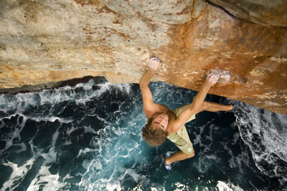 Chris Sharma rock climbing / deep water soloing in Mallorca, Spain.