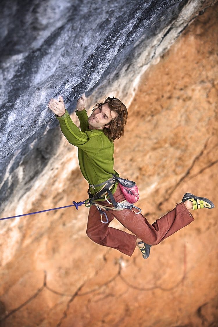 A man rock climbs in Spain.
