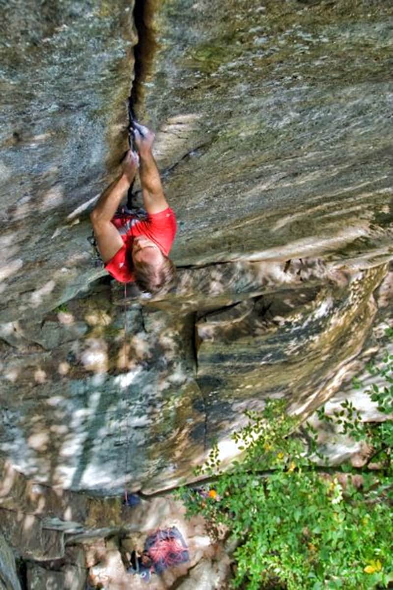The author on the Red River Gorge's classic hard splitter, Welcome to Ol' Kentucky (5.13a). Photo: Tristan Croll